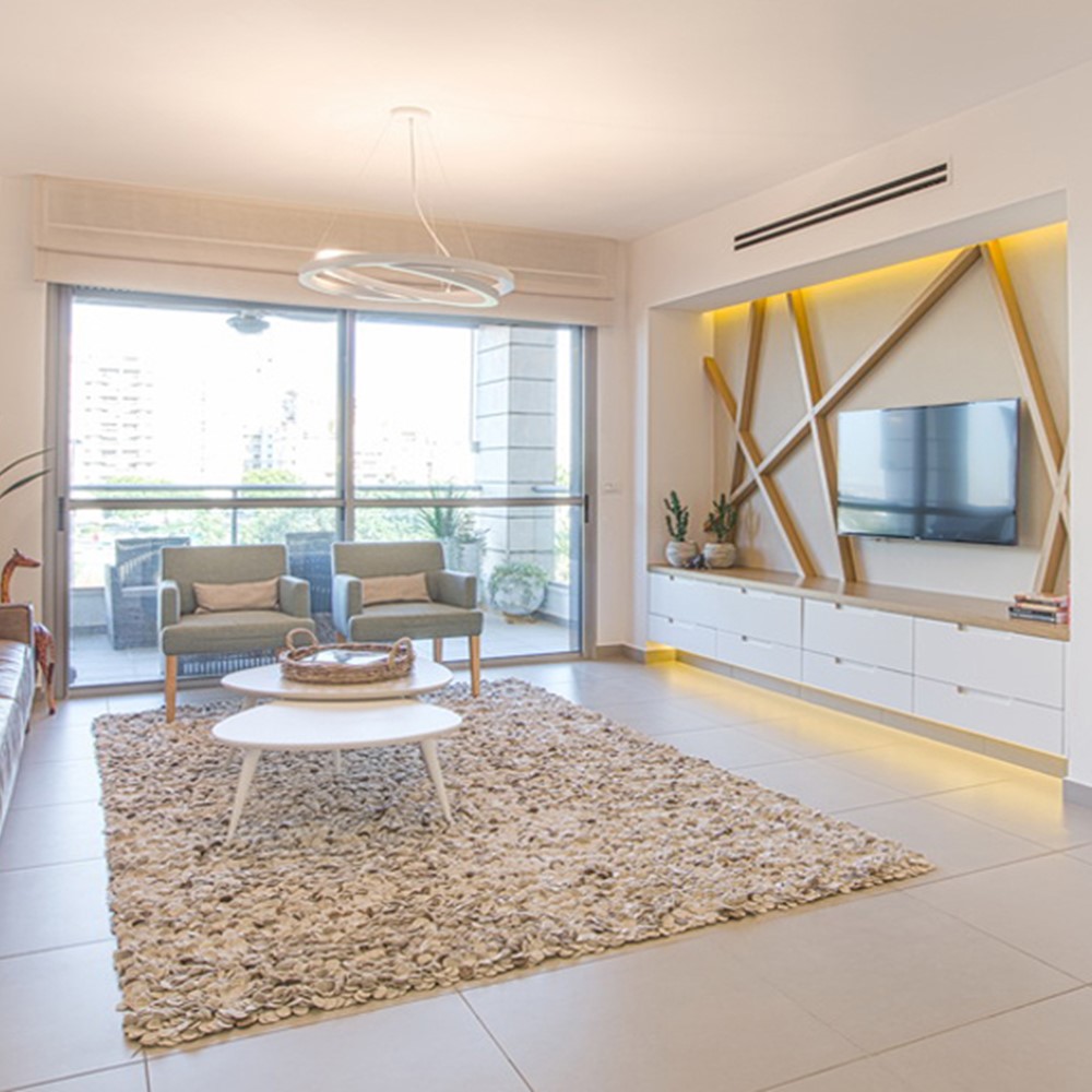 תכנון וליווי בניה של דירת קבלן במגדל. האתגר היה לייצר דירה נוחה לגידול ילדים קטנים בלי להתפשר מראה ייצוגי. צילום לירון שמש